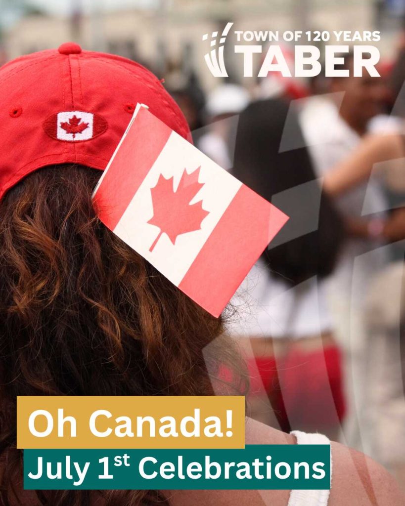 A woman with a Canadian flag in her hair, seen from behind, celebrating Canada Day in Taber.