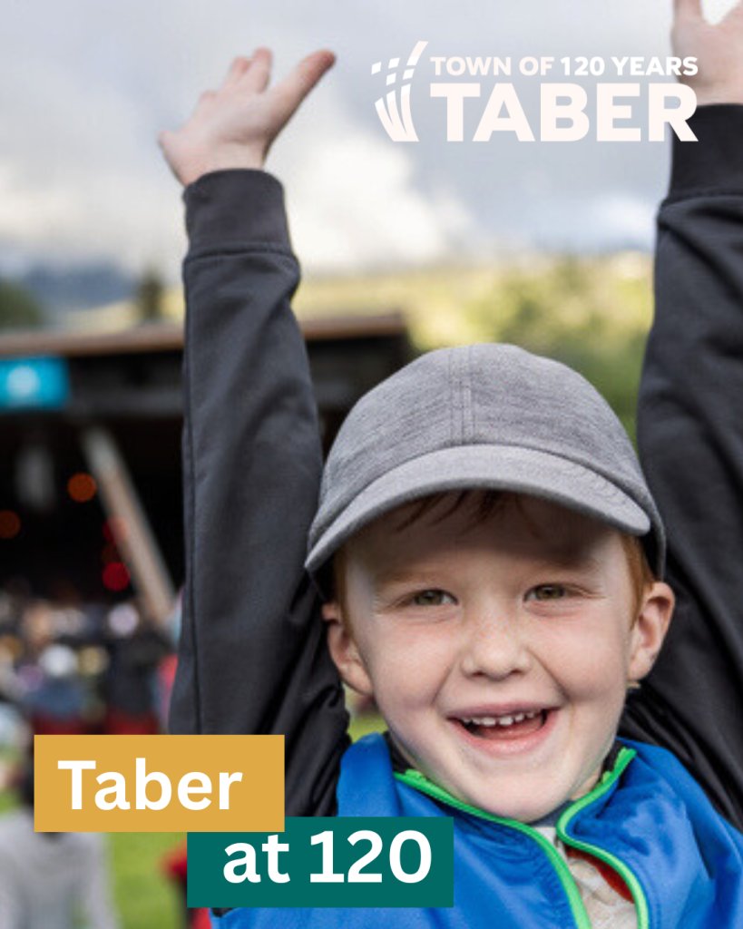 A smiling child enjoying the festivities at Taber’s 120th anniversary celebration, symbolizing community spirit and pride.